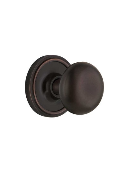 Classic Rosette Mortise Lock Set with Round Brass Knobs in Timeless Bronze.